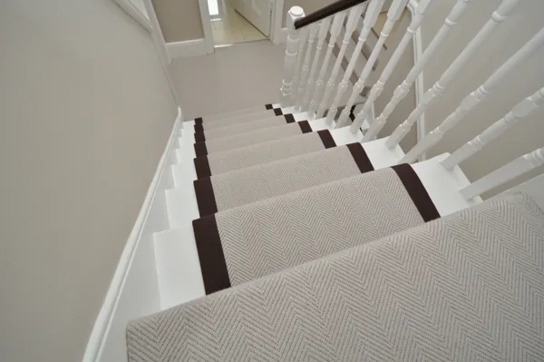 Beige herringbone patterned wool stair runner with brown borders