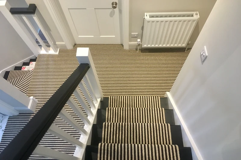 Black and white striped carpet on stairs and landing