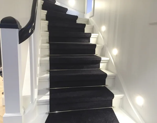 Black plush stair runner carpet with silver stair rods