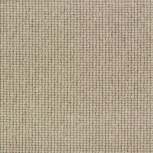 Close-up of a beige textured loop pile carpet with a grid pattern.