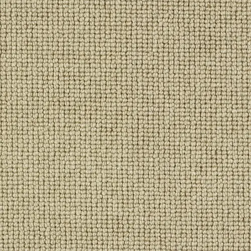 Close-up texture of warm tan loop pile carpet in a grid pattern.