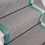 Country House Grey Shingle Striped stair runner with teal edging and black stair rods.