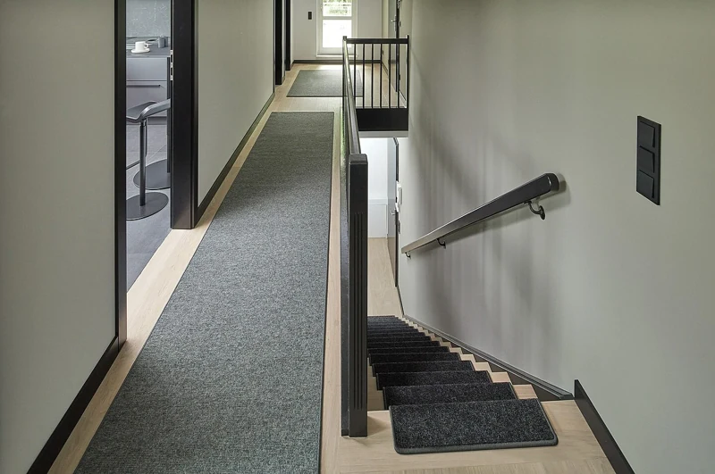 Dark hallway runner with matching stair tread mats
