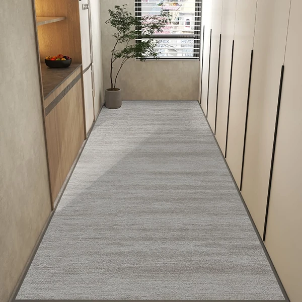 Grey textured runner carpet in a modern narrow hallway
