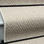 Harrison Cream Herringbone Stair Runner carpet on a stair with a rod.