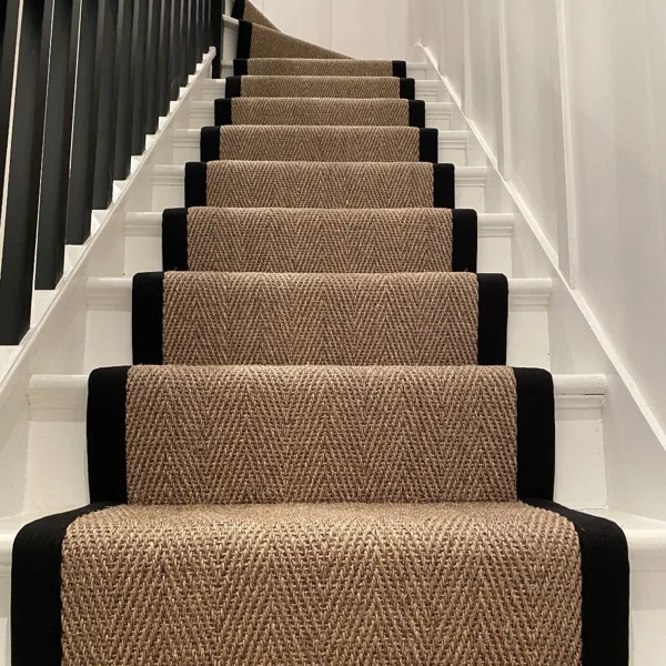 Herringbone sisal stair runner with black fabric border