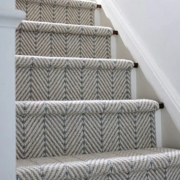 Blue striped carpet runner installed in waterfall style