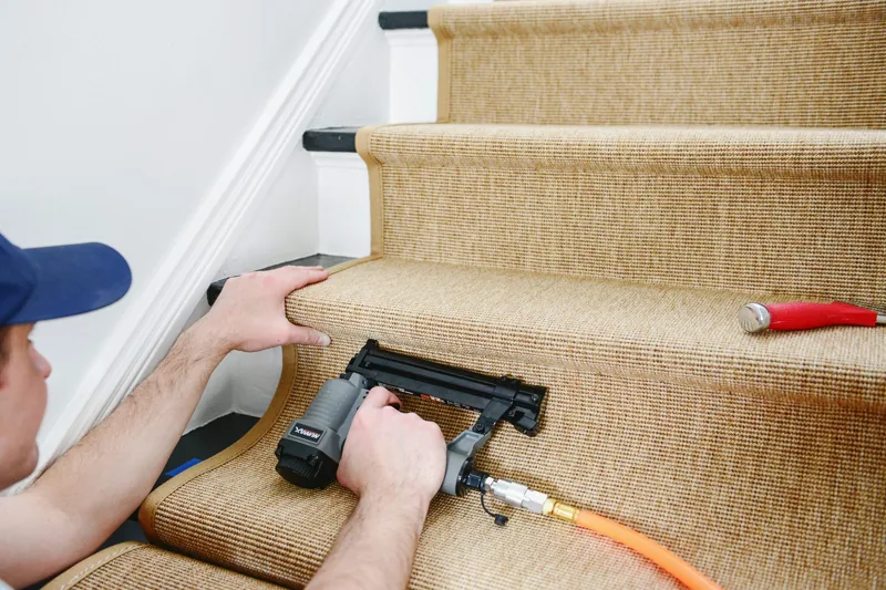 Nailing textured carpet runner to wooden stair riser
