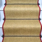 Oatmeal herringbone sisal stair runner with red edging and black stair rods. (1)
