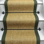 Oriental natural sisal stair runner with olive green edging and black stair rods. (1)