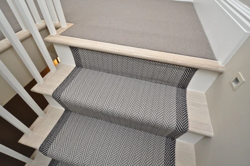 Patterned grey chevron runner on white stairs