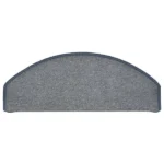Semi-oval blue-grey carpet stair tread with bound edges.