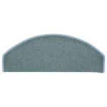 Semi-oval grey carpet stair tread with light blue stitched border.