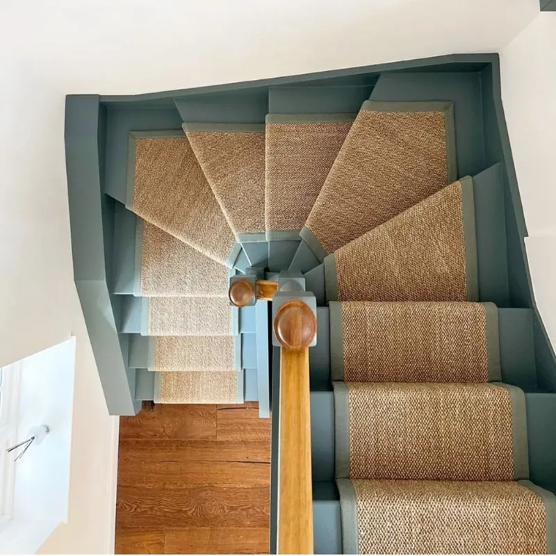 Sisal runner on a teal painted staircase