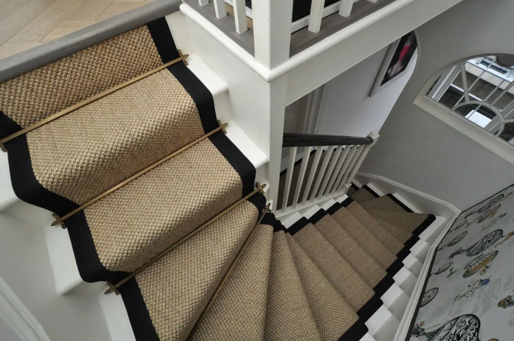 Sisal stair runner with black border and brass rods