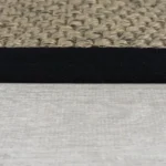 Taupe textured loop stair carpet with black edge binding.