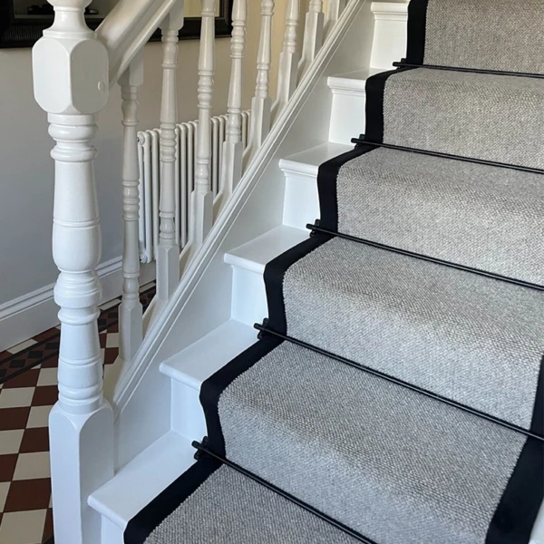 Textured grey woven stair runner with thick black borders