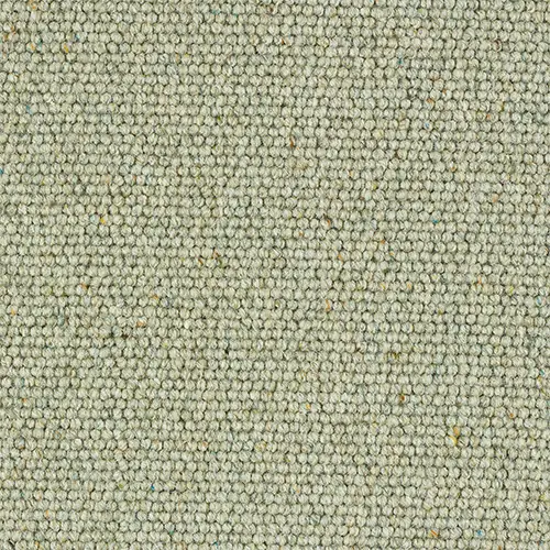 Textured light sage green loop pile wool carpet close-up swatch