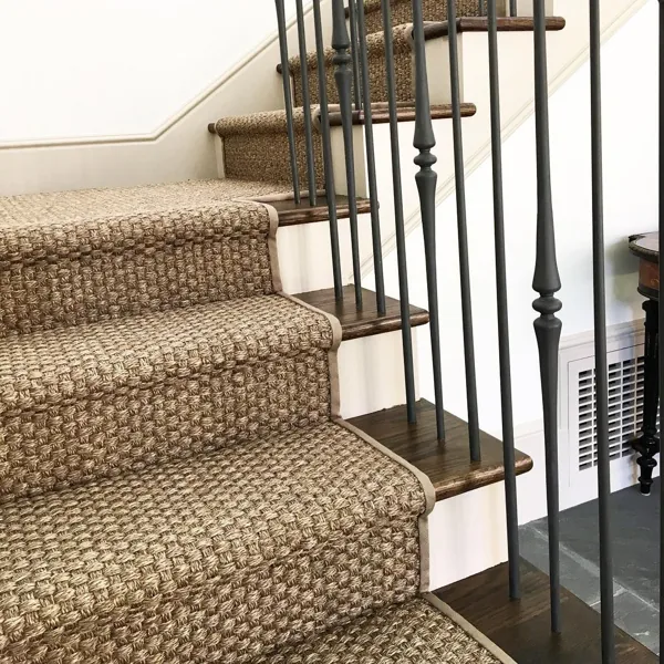 Thick chunky sisal stair runner on dark wood steps