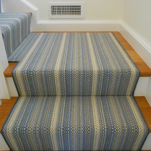 Blue striped carpet runner installed in waterfall style